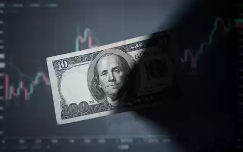 Eine stilisierte CAD-Banknote, teilweise im Schatten, vor einem verschwommenen Finanzchart, der den Verlust darstellt. - Foto: über boerse-global.de