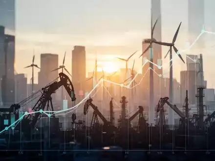 Ein stilisierter, aufwärts gerichteter Börsenchart, überlagert von Silhouetten industrieller Maschinen und Windturbinen, vor einer Stadtlandschaft im Morgengrauen. - Foto: über boerse-global.de