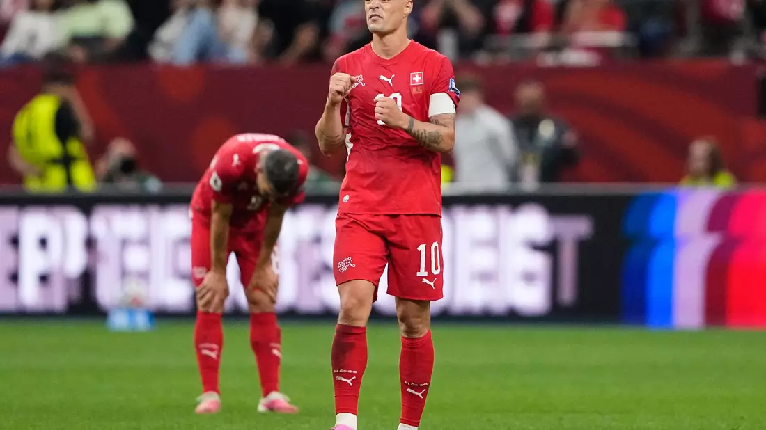 150 Spiele, ein Ziel: Xhaka führt die Schweiz an. - Bild: Lindsey Wasson/AP/dpa