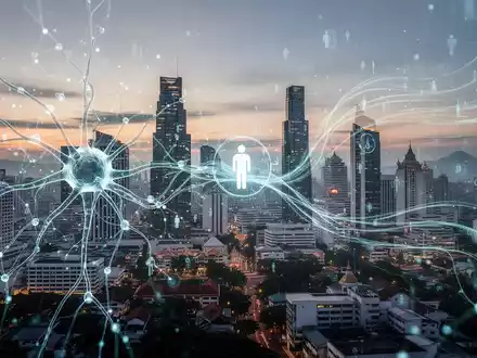 Ein stilisiertes neuronales Netzwerk über einer südostasiatischen Stadtlandschaft bei Sonnenuntergang, das Effizienz und Technologie symbolisiert. - Foto: über boerse-global.de