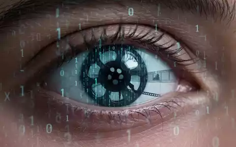 Menschliches Auge spiegelt Binärcode und Filmsilhouette, Symbol für KI, Filmproduktion und Unternehmensstrategie. - Foto: über boerse-global.de