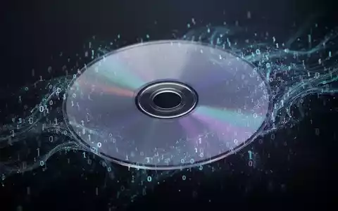 Eine PlayStation-Spiel-Disc löst sich in digitale Daten auf, symbolisiert den Wandel von physischen Medien zu digitalen Downloads. - Foto: über boerse-global.de