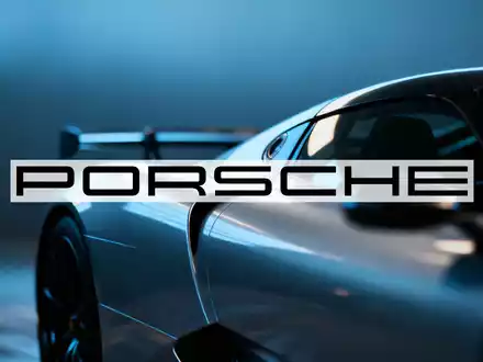 Abstrakte Szene des Luxusautomobilsektors mit angedeuteten Fahrzeugsilhouetten und eleganten Lichtreflexionen. - Foto: über boerse-global.de