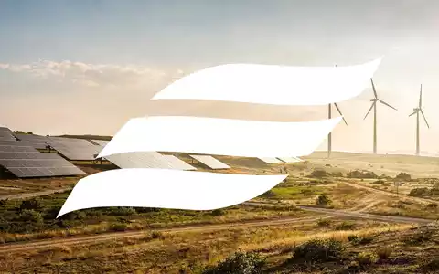 Abstrakte Darstellung des Energiesektors mit erneuerbaren Energiequellen in einer weiten, sonnigen Landschaft, die Wachstum und Nachhaltigkeit symbolisiert. - Foto: über boerse-global.de