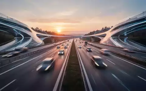 Eine moderne, mehrspurige deutsche Autobahn bei Sonnenuntergang, mit unscharfen Autos und futuristischem Design. - Foto: über boerse-global.de