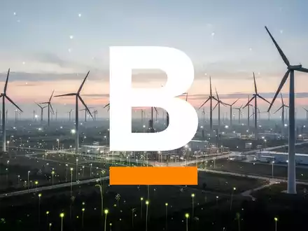 Eine weitläufige, moderne Landschaft für erneuerbare Energien bei Sonnenaufgang, die Wachstum und große Investitionen symbolisiert. - Foto: über boerse-global.de