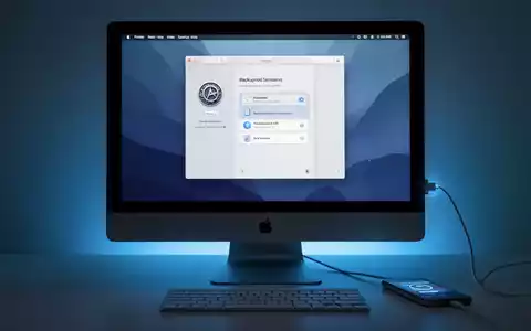 Moderner Apple Mac Computer mit verbundenem iPhone, Finder-Fenster mit Backup-Optionen auf dem Bildschirm. - Foto: über boerse-global.de