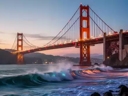 Die Golden Gate Bridge in der Dämmerung, mit animierten Wellen darunter und Fahrzeuglichtern, die über die Brücke ziehen. - Foto: über boerse-global.de