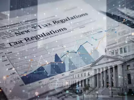 Abstrakte Darstellung von Finanzdokumenten und Diagrammen, die neue Umsatzsteuerregeln für Kommunen symbolisieren. - Foto: über boerse-global.de