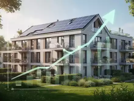 Ein modernes, energieeffizientes Wohngebäude mit Solarpaneelen und grüner Umgebung, das Nachhaltigkeit und Wertsteigerung symbolisiert. - Foto: über boerse-global.de