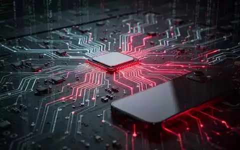 Nahaufnahme einer leuchtenden Leiterplatte mit rotem Licht, das einen Cyber-Angriff symbolisiert, und einem teilweise sichtbaren Smartphone. - Foto: über boerse-global.de