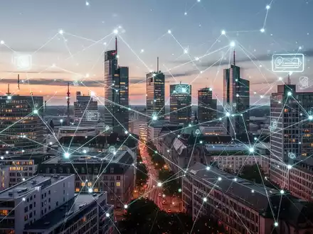 Eine stilisierte digitale Netzwerkgitterstruktur über einer modernen deutschen Stadtkulisse bei Dämmerung, die den elektronischen Datenaustausch symbolisiert. - Foto: über boerse-global.de