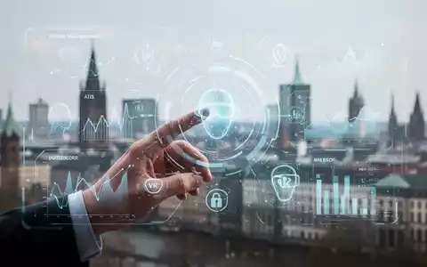 Eine Hand interagiert mit einer holografischen Oberfläche, die Gesundheitsdaten, KI-Symbole und VR-Elemente anzeigt, mit Düsseldorfer Skyline im Hintergrund. - Foto: über boerse-global.de