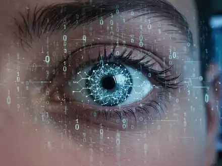 Ein menschliches Auge mit einer digitalen Überlagerung aus Binärcode oder einem neuronalen Netzwerk, das KI-Betrug und Deepfakes symbolisiert. - Foto: über boerse-global.de