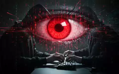 Ein bedrohliches, rot leuchtendes Auge aus Binärcode und Datenströmen über einer Person, die im Dunkeln an einem Computer tippt. - Foto: über boerse-global.de