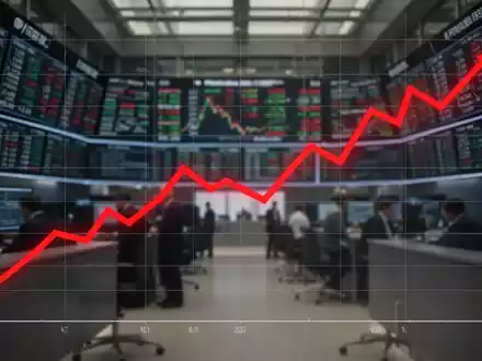 Ein roter Abwärtstrend-Graph über einem unscharfen Hintergrund eines Börsenhandelsraums mit digitalen Anzeigen. - Foto: über boerse-global.de