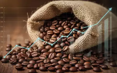 Nahaufnahme von gerösteten Kaffeebohnen, die aus einem Jutesack quellen, mit einem subtilen positiven Finanzdiagramm im Hintergrund. - Foto: über boerse-global.de