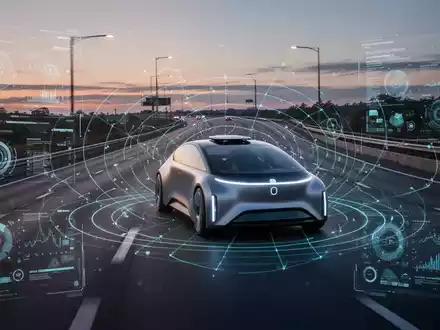 Ein futuristisches autonomes Fahrzeug fährt bei Dämmerung auf einer Autobahn, digitale Schnittstellen heben seine fortschrittliche Technologie hervor. - Foto: über boerse-global.de