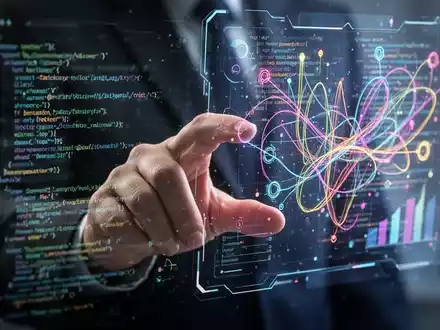 Eine Hand interagiert mit einer holografischen Schnittstelle, die abstrakten Code und Designelemente zeigt und KI-Werkzeuge für Design und Entwicklung symbolisiert. - Foto: über boerse-global.de