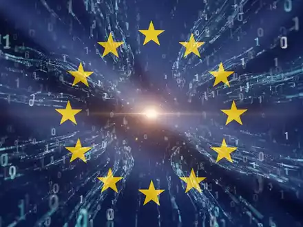 EU-Flagge mit Binärcode, symbolisiert KI-Regulierung und -Politik in Mitgliedsstaaten. - Foto: über boerse-global.de