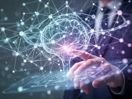 Abstrakte digitale Schnittstelle mit leuchtenden Knoten und Linien, die KI und Datenverarbeitung symbolisieren, mit einer subtilen menschlichen Hand, die mit einem holografischen Bildschirm interagiert. - Foto: über boerse-global.de