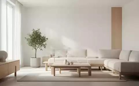 Ein minimalistisch eingerichtetes Wohnzimmer mit hellen Wänden, neutralen Farben und einer einzelnen Pflanze, die Ruhe ausstrahlt. - Foto: über boerse-global.de