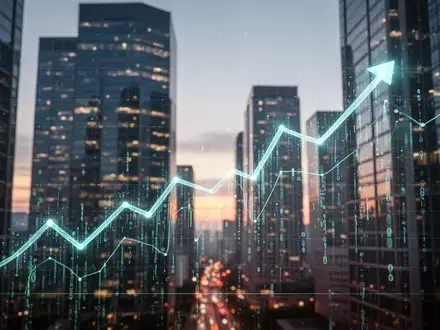 Eine aufwärts gerichtete Wachstumskurve aus Lichtlinien vor dem Hintergrund moderner Bürogebäude bei Sonnenuntergang. - Foto: über boerse-global.de