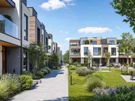 Vistry Group PLC GB0009692319 visualisiert ein modernes Architektur-Render einer nachhaltigen Wohnanlage mit Grünflächen - Foto: THN