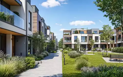 Vistry Group PLC GB0009692319 visualisiert ein modernes Architektur-Render einer nachhaltigen Wohnanlage mit Grünflächen - Foto: THN