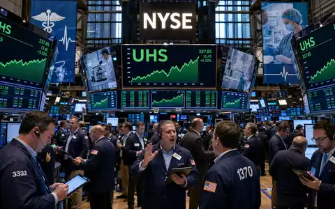 Börsen-Editorial zeigt Handelsraum der NYSE mit Kurscharts für Universal Health, Aktie ISIN US9139031002, im Gesundheitssektor - Foto: THN