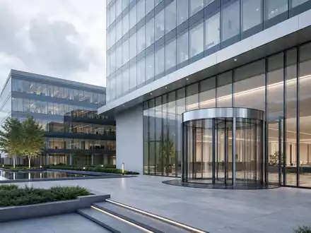 Dormakaba Holding AG (CH0011795959) zeigt Architektur-Render einer modernen Firmenzentrale mit gläsernem Drehtür-Eingangssystem und Grünanlage - Foto: THN