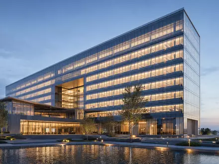 Investor AB (ISIN SE0015811963) visualisiert als futuristisches Architektur-Render eines modernen nordischen Holding-Hauptsitzes bei Nacht - Foto: THN