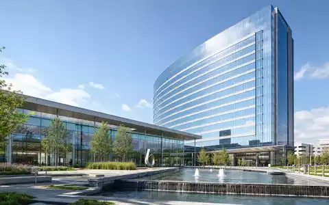 GE HealthCare US36266G1076 als Architektur-Render eines modernen Glas und Stahl Hochhauses mit Brunnen-Platz - Foto: THN