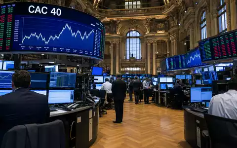 Compagnie de Saint-Gobain S.A. (FR0000125007) ist im CAC 40 gelistet, symbolisiert durch diese Pariser Börsenhandelsraum-Szene - Foto: THN