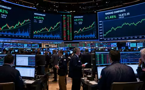 Gilead Sciences NASDAQ Handelssaal ISIN US3755581036 Biotech-Sektor grüne Kerzencharts Trader digitale Bildschirme - Foto: THN