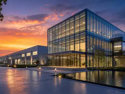 IDEX Corporation US45167R1041 zeigt den modernen Industriecampus im Architektur-Render bei atmosphÀrischer AbenddÀmmerung - Foto: THN