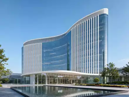 UCB S.A. (BE0003739530) symbolisiert durch elegantes Architektur-Render eines modernen Biopharma-Hauptsitzes mit Glasfassade - Foto: THN