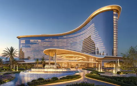 Wynn Resorts Ltd (US9831341030) entwickelt moderne Resort-Architektur mit markanten Glasfassaden und gepflegten Gartenanlagen - Foto: THN