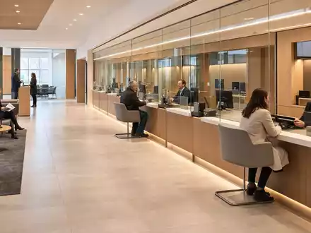 Banco Santander (ISIN ES0113900J37): fotorealistische moderne Bankfiliale mit Kunden und Beratern am Schalter - Foto: THN