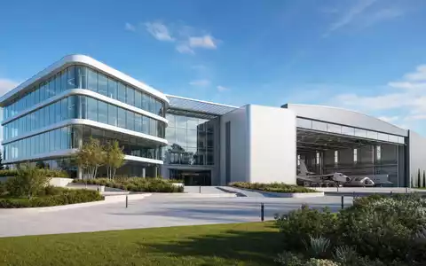 Dassault Aviation SA (FR0000121725): Architektur-Render zeigt modernes FirmengebÀude mit glÀserner Fassade und angrenzendem Flugzeughangar - Foto: THN