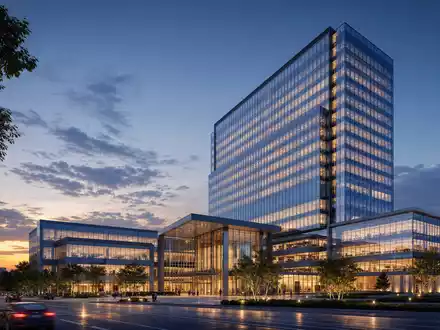 Talanx AG (DE000TLX1005) illustriert durch einen Architektur-Render eines modernen gläsernen Versicherungs-Hochhauses am Abend - Foto: THN