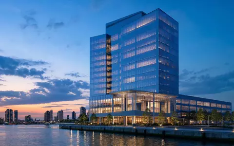 Raymond James Financial US7547301090 visualisiert ein modernes Glas-Hochhaus als Architektur-Render zur Abenddämmerung - Foto: THN