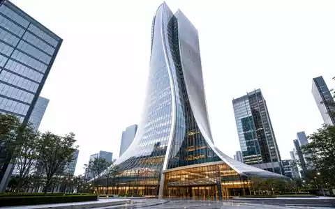 Apollo Global Management US0376123065 präsentiert futuristisches Hochhaus-Render mit parametrischer Glasfassade im modernen Finanzviertel - Foto: THN