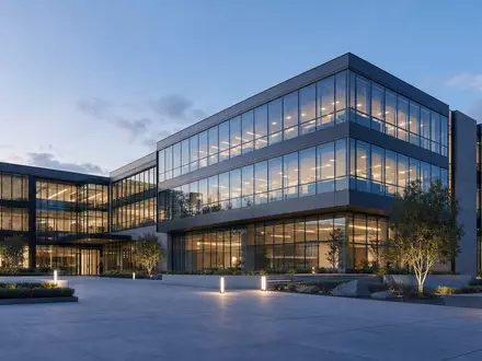 Kontron AG (DE0006053952) zeigt ein architektonisches 3D-Render eines modernen Technologie-Firmengebäudes bei Abenddämmerung - Foto: THN