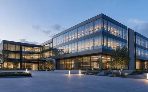 Kontron AG (DE0006053952) zeigt ein architektonisches 3D-Render eines modernen Technologie-Firmengebäudes bei Abenddämmerung - Foto: THN
