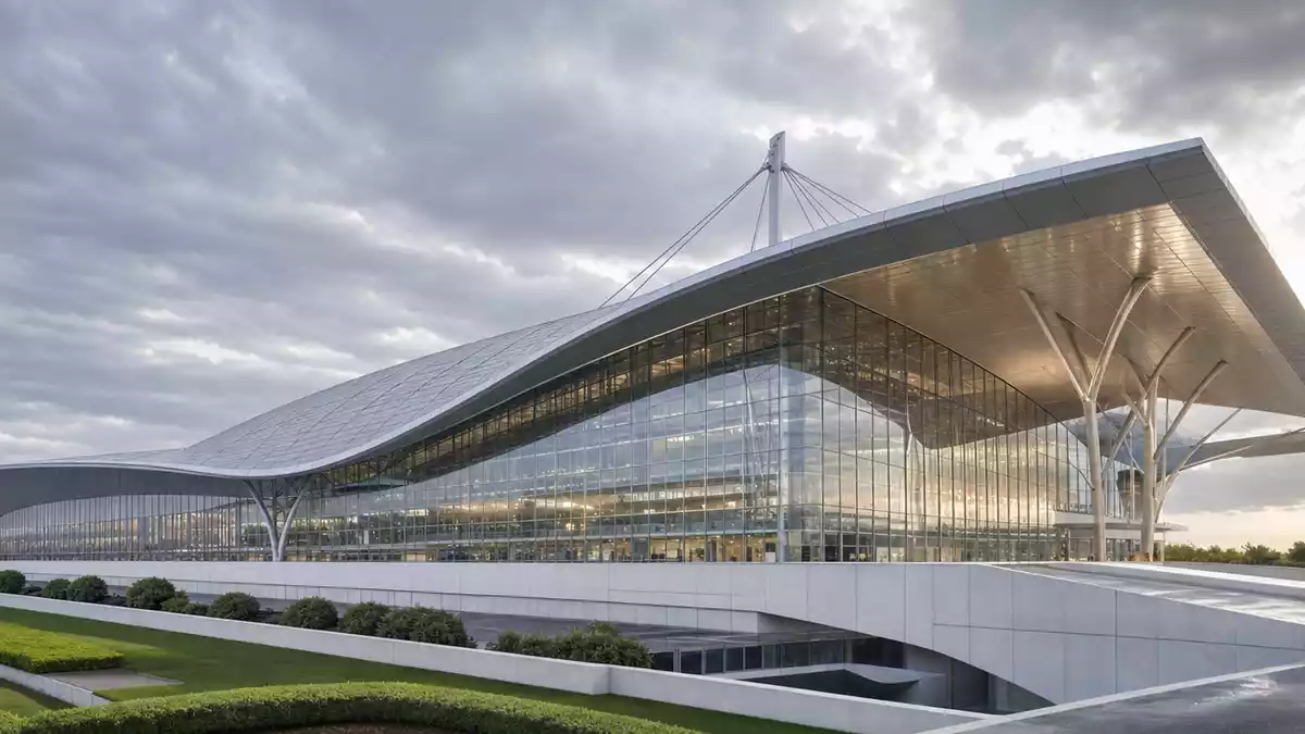 CGI-Architekturrender eines modernen Flughafenterminals mit geschwungener Glasfassade und Stahlkonstruktion