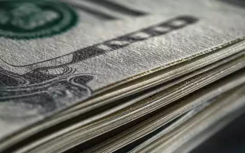 Makroaufnahme von Banknoten zeigt das Kerngeschäft von Wells Fargo & Co., ISIN US9497461015, im Bankensektor - Foto: THN