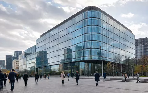 NN Group N.V. (ISIN NL0010773842) betreibt moderne Bürotürme in Den Haag mit gläserner Fassade - Foto: THN