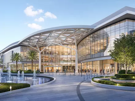Simon Property Group US8288061091 illustriert als modernes Architektur-Render eines Einkaufszentrums mit Glasfassade und Brunnen - Foto: THN