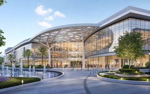 Simon Property Group US8288061091 illustriert als modernes Architektur-Render eines Einkaufszentrums mit Glasfassade und Brunnen - Foto: THN